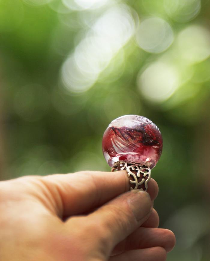 'sparkle in flight' round art ring with feathers