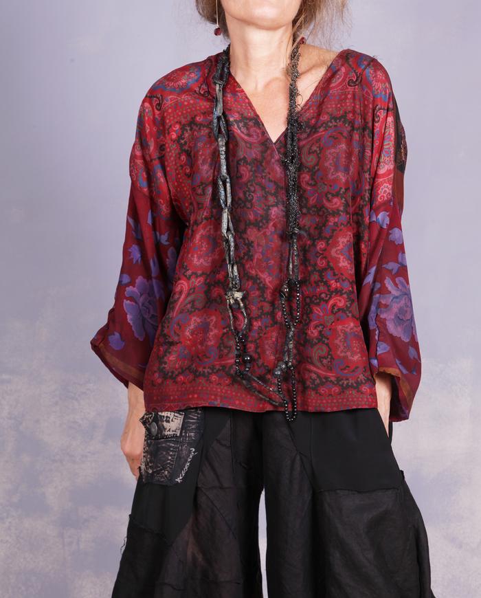 'a delicate enigma' mixed patterns silk blouse