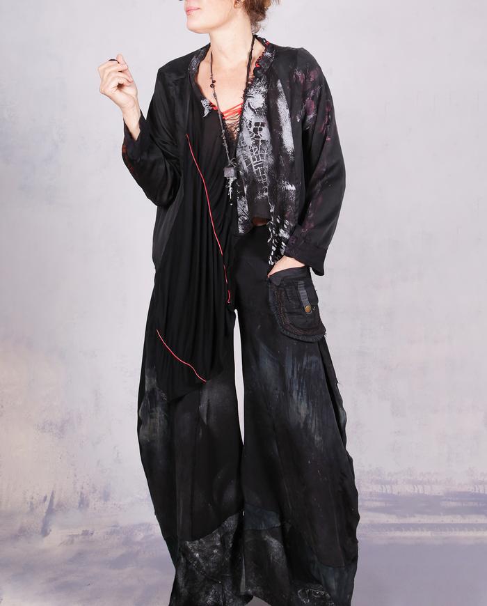 'no such thing as too much freedom' loose-fitting asymmetrical blouse