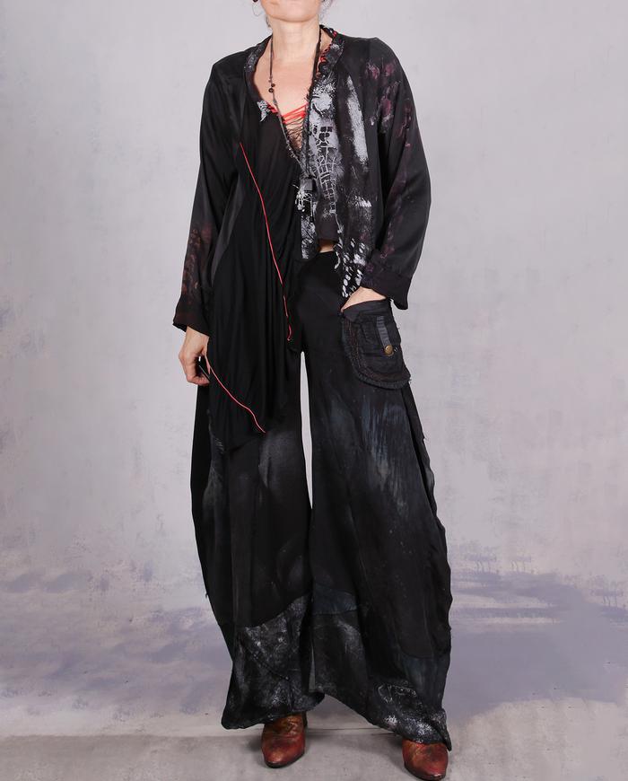 'no such thing as too much freedom' loose-fitting asymmetrical blouse