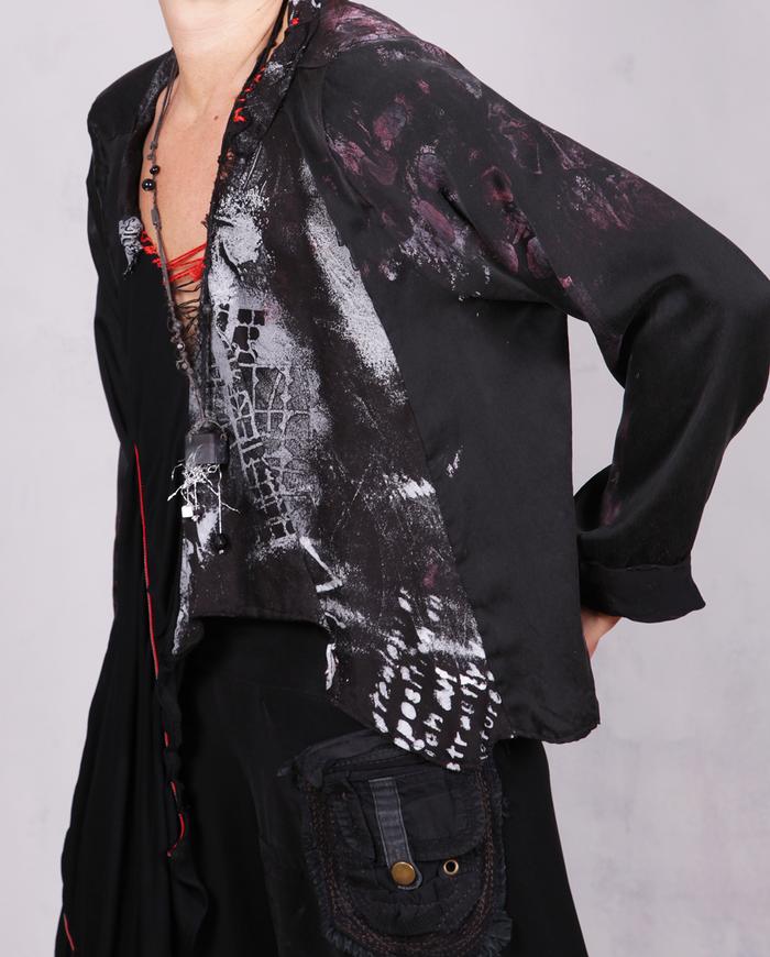 'no such thing as too much freedom' loose-fitting asymmetrical blouse