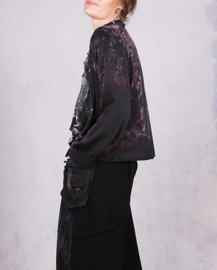 'no such thing as too much freedom' loose-fitting asymmetrical blouse