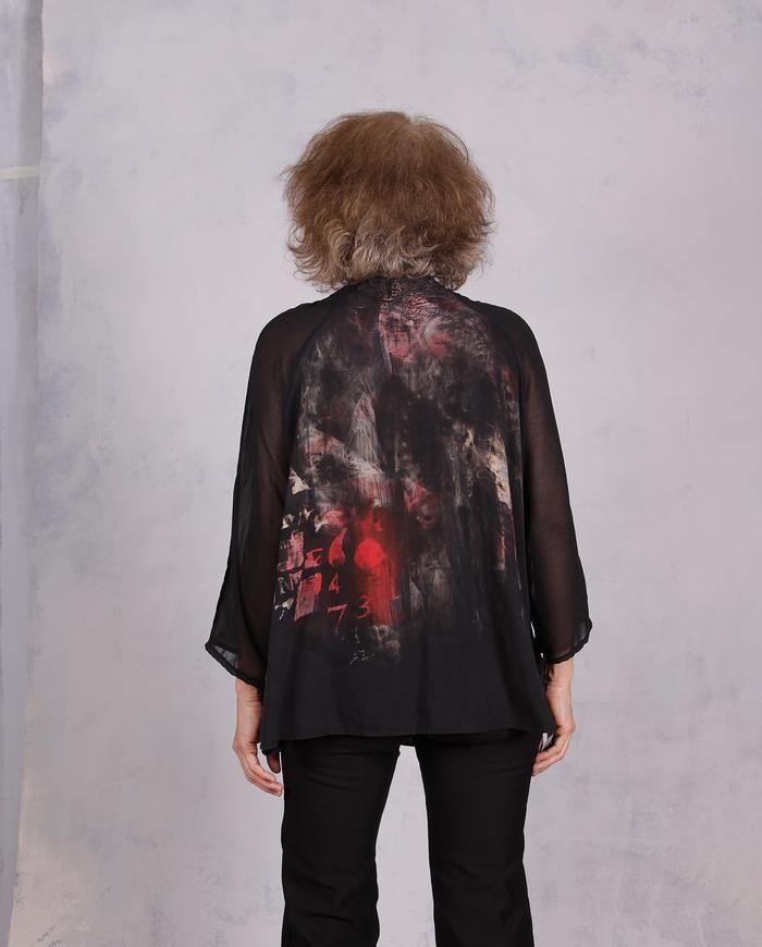 'light on the horizon' painted black blouse