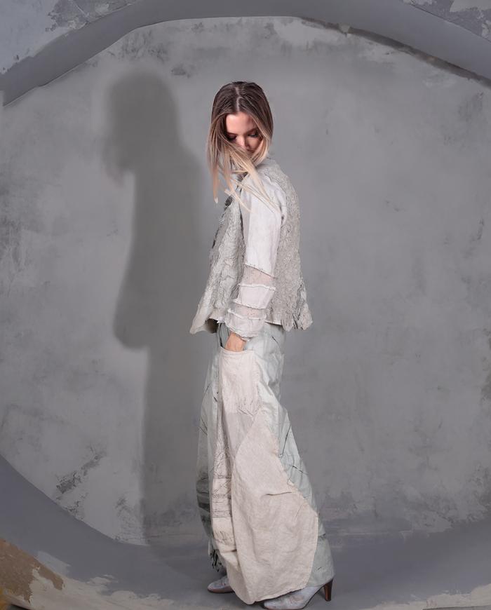 'on a misty cobblestone mountain' super detailed couture jacket