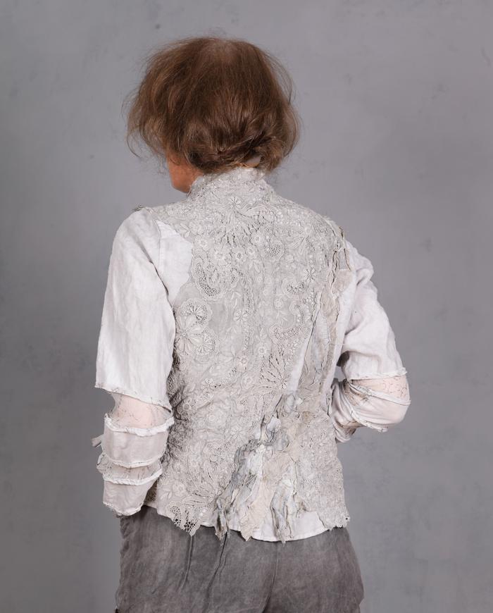 'on a misty cobblestone mountain' super detailed couture jacket