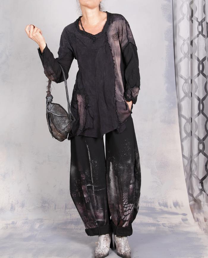 'every step I make' sculptural black painted trousers