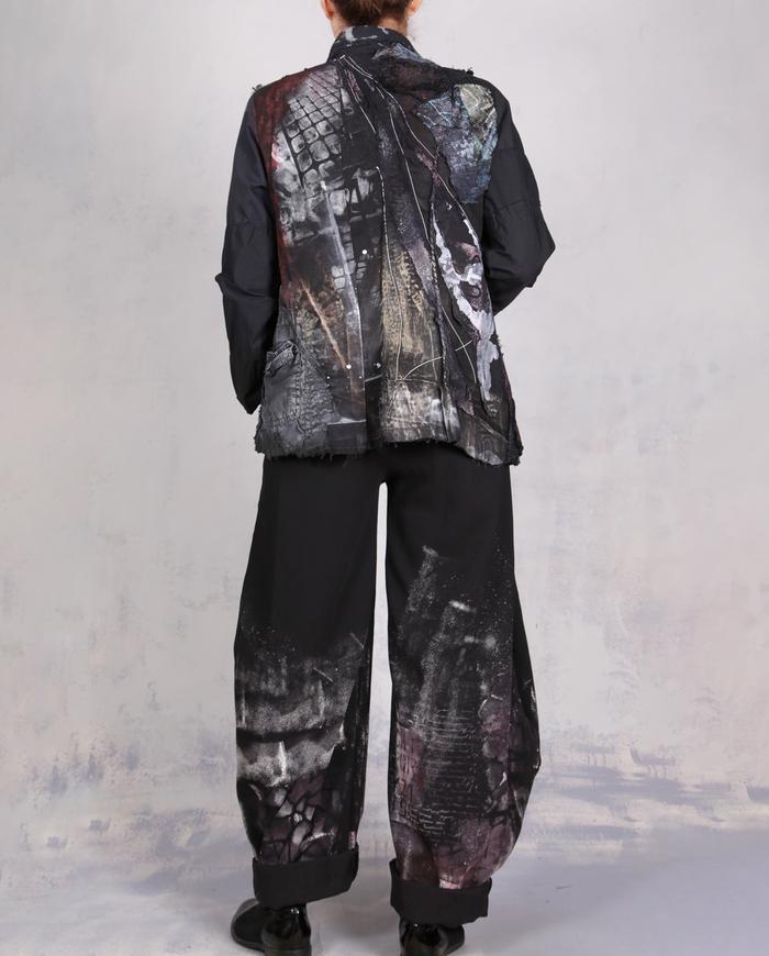 'every step I make' sculptural black painted trousers
