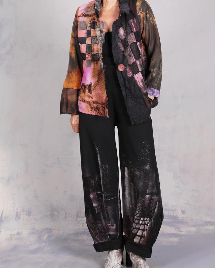 'every step I make' sculptural black painted trousers