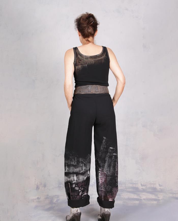 'every step I make' sculptural black painted trousers
