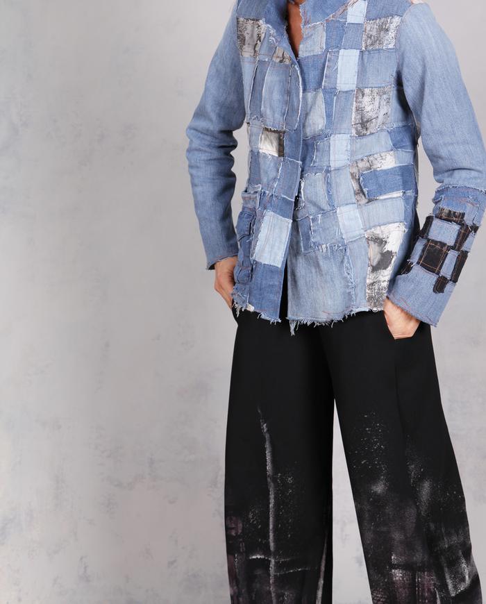 'every step I make' sculptural black painted trousers
